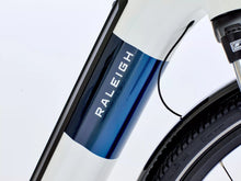 Load image into Gallery viewer, Close-up of a Raleigh e bike frame with a white and blue design.