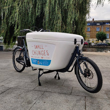 Load image into Gallery viewer, A close up of the Small Changes branding on a Raleigh Pro eCargo bike.