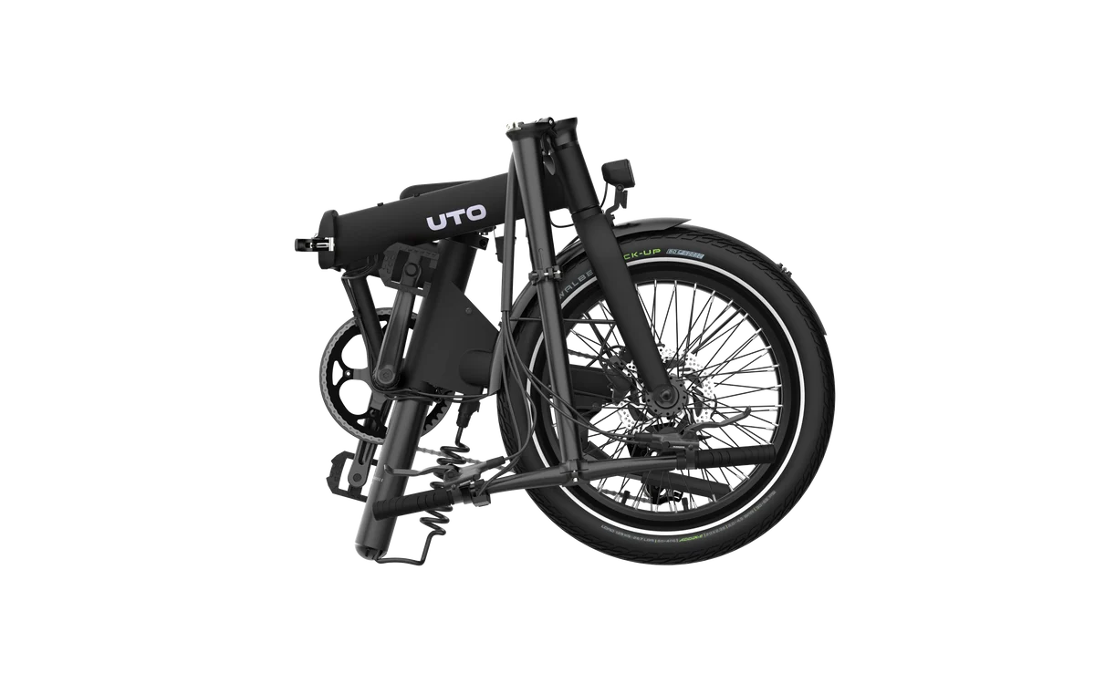 A folded black folding ebicycle on a white background