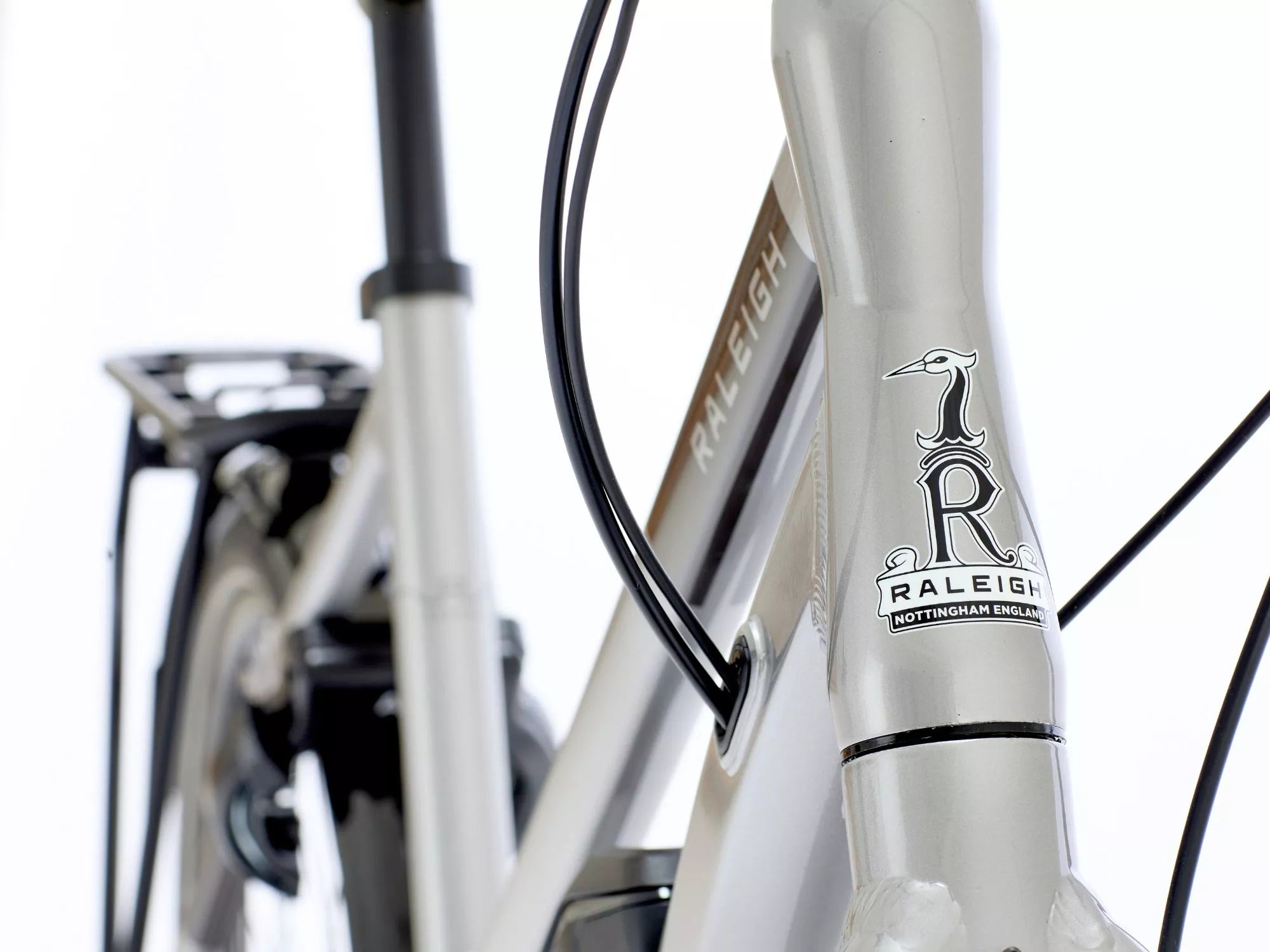 Close-up of a Raleigh bicycle with branding on the frame.