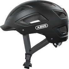 Load image into Gallery viewer, A product image of the Abus Hyban 2.0 cycle safety helmet, showing the colour option for Velvet Black.
