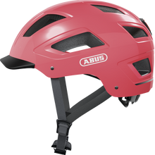 Load image into Gallery viewer, A product image of the Abus Hyban 2.0 cycle safety helmet, showing the colour option for Living Coral.
