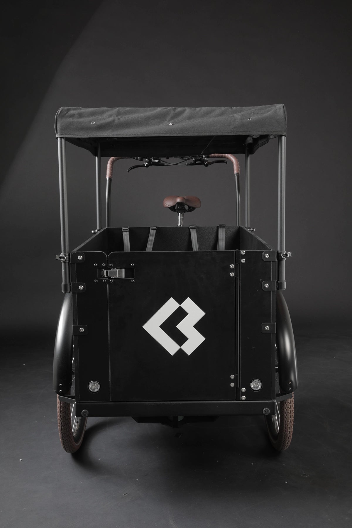 Product image of the Bimas eCargo 3.3 Premium electric cargo bike, showing the optional sun shade which can be added to the cargo bike.
