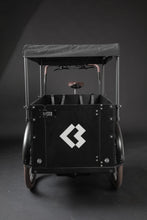 Load image into Gallery viewer, Product image of the Bimas eCargo 3.3 Premium electric cargo bike, showing the optional sun shade which can be added to the cargo bike.
