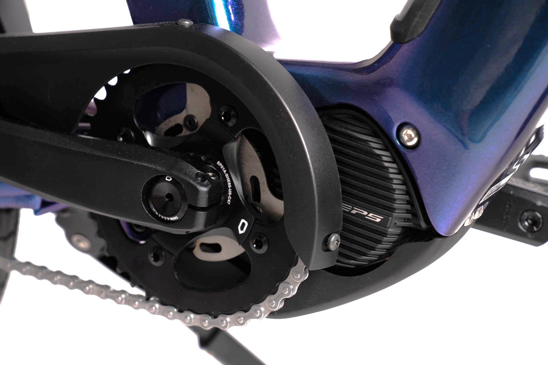 A product image showing a close-up of the chain and electric motor on the BESV CPT 1.4 compact electric bike.