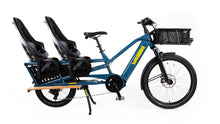 Load image into Gallery viewer, A product image of the Yuba Spicy Curry V4 electric longtail cargo bike. The frame colour is True Blue and the bike is set up with two rear child seat add-ons and a front bread basket.. 
