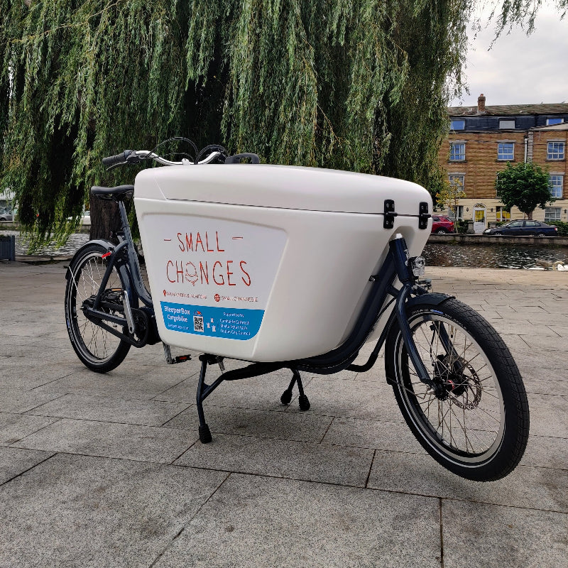 A close up of the Small Changes branding on a Raleigh Pro eCargo bike. 