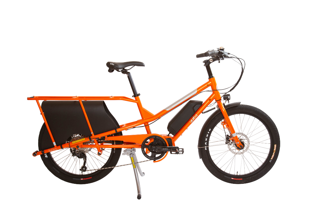 A product image of the Yuba Kombi E5 electric longtail cargo bike which can be hired from LeaseBike. The photo shows the right side of the cargo bike in its bare configuration without any accessories attached. 