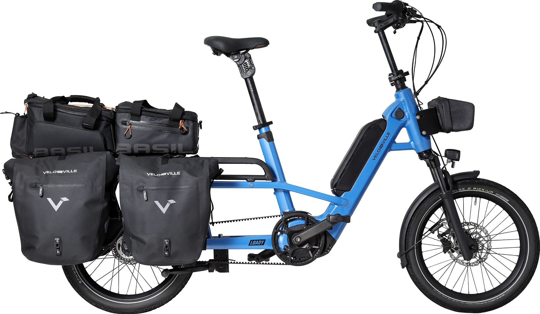 A product image of the Velo de Ville Loady electric longtail cargo bike. The frame colour is blue. Two pairs of carrier bags are attached to the rear rack.
