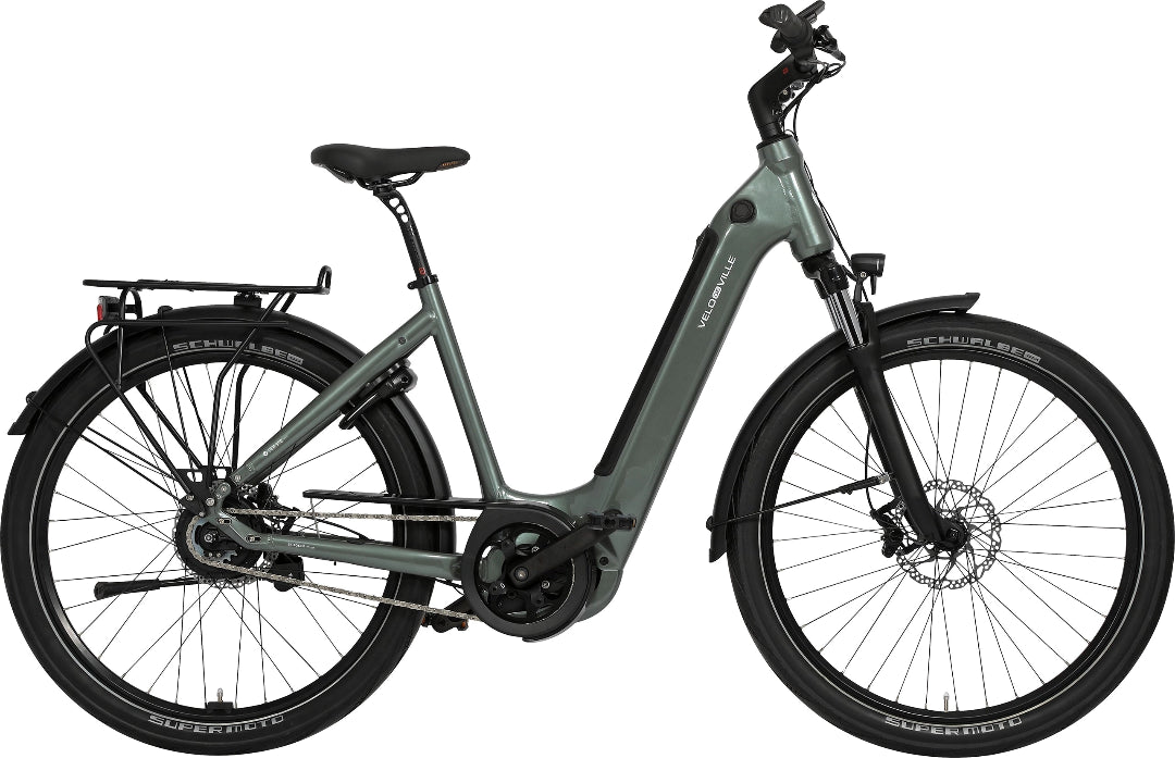 A product image of the VELO DE VILLE SEB electric bike, featuring a Eucalyptus Green frame colour.