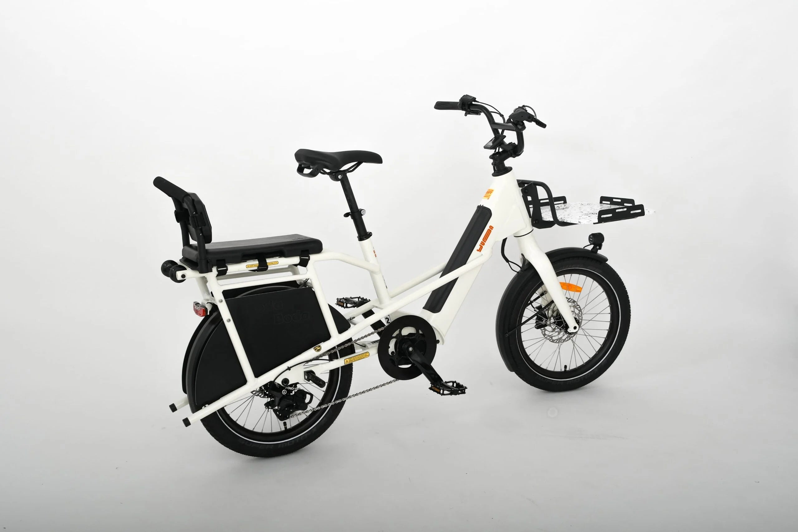 White electric bike with black seat and tires on a light gray background