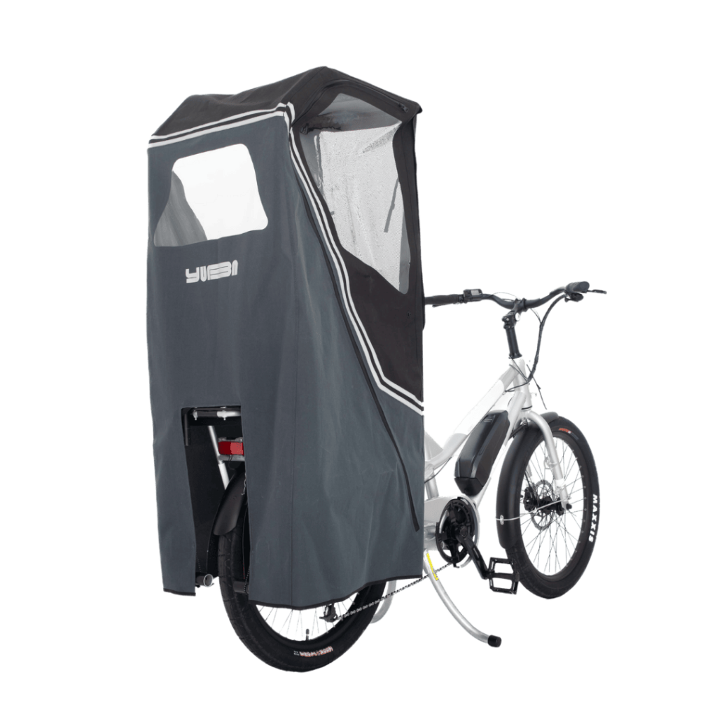 Bicycle with a gray cover attached to it on a white background