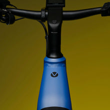 Load image into Gallery viewer, A close-up image showing the detail of the blue frame colour of a VELO DE VILLE electric bike.
