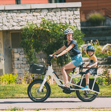 Load image into Gallery viewer, An electric bike carrying two people.
