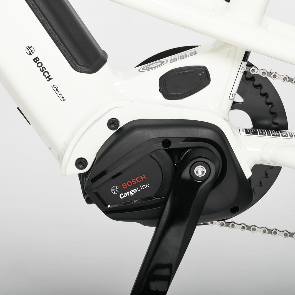 Close-up of a bicycle gear system with Bosch CargoLine motor on a white background