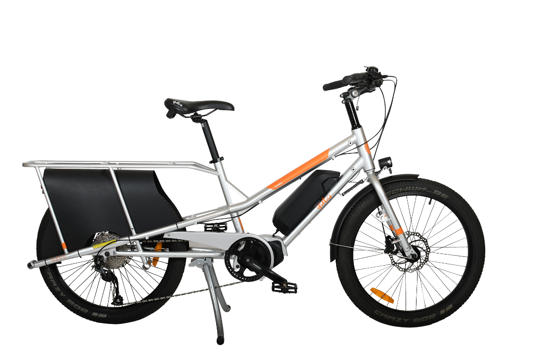 A product image of the Yuba Kombi E5 electric longtail cargo bike which can be hired from LeaseBike. The photo shows the right side of the cargo bike. 