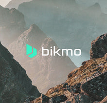 Load image into Gallery viewer, A photo of a scenic mountain setting with the Bikmo logo overlaid in front.
