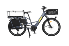 Load image into Gallery viewer, A product image showing the right side of the Yuba Boda Boda electric longtail cargo bike with the Monkey Bars and front basket accessories attached.
