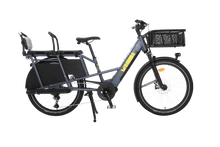Load image into Gallery viewer, A product image showing the right side of the Yuba Boda Boda electric longtail cargo bike with the rear seat and front basket accessories attached.
