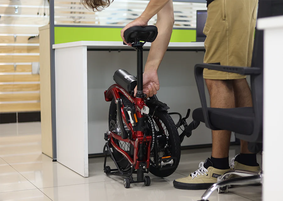 The Dahon Curl shown in its folded configuration under a desk.