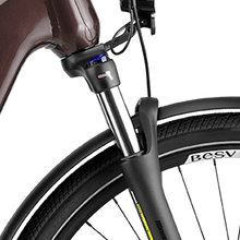 Load image into Gallery viewer, A product image of the BESV TR 1.3 electric bike, showing a close-up of the front fork suspension.
