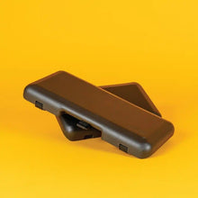 Load image into Gallery viewer, Two black padded bike seat pads stacked on a bright yellow background, designed for rear racks on electric cargo bikes.
