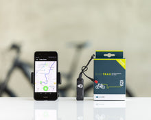 Load image into Gallery viewer, A GPS tracking device for bicycles, showing a smartphone displaying the tracking app and the product packaging box.
